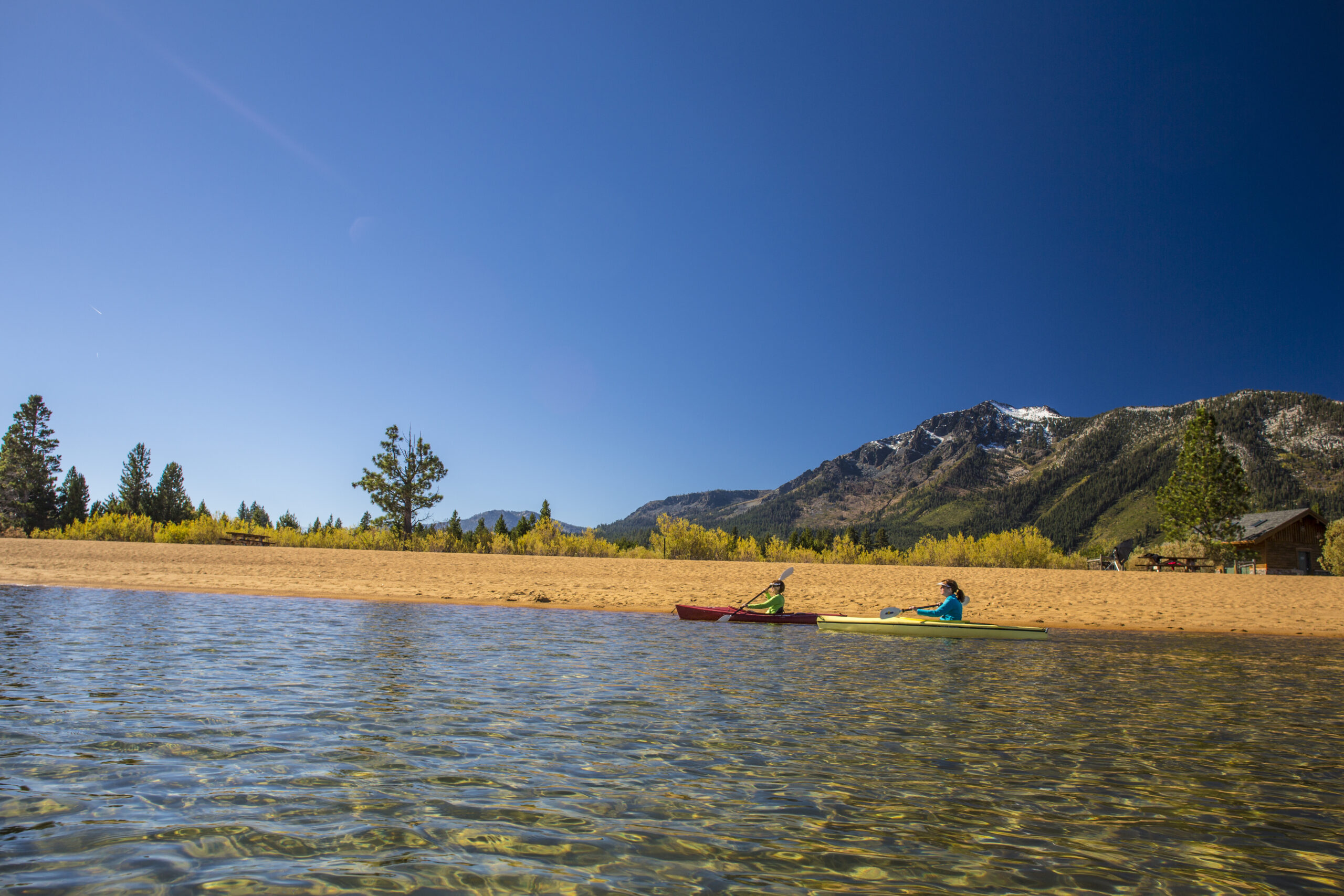 Two children kayaking on lake Tahoe